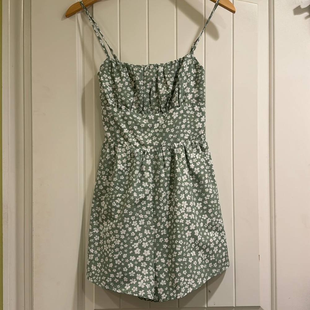 Spaghetti strap romper with smocked bust and adjustable straps
